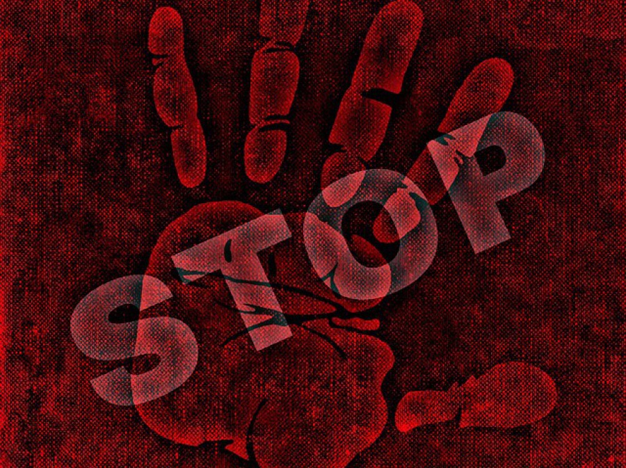 Schriftzug Stop und Handabdruck roter Hintergrund